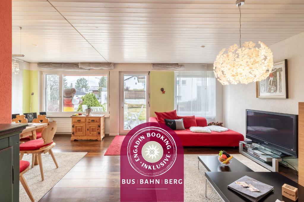 a living room with a bus britain beef sign in a living room at Feriensiedlung Trü 2 in Scuol