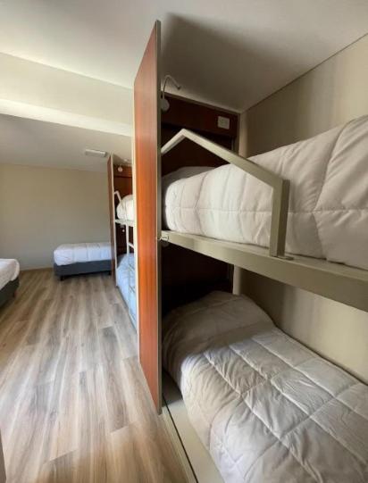 Postel nebo postele na pokoji v ubytování Nómade Hostel mdz