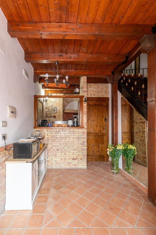 Kuchyň nebo kuchyňský kout v ubytování Elsa d'Ortigia - I TRE ARCHI
