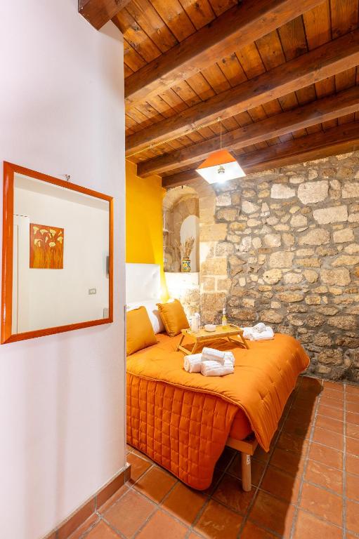 Postel nebo postele na pokoji v ubytování Elsa d'Ortigia - I TRE ARCHI