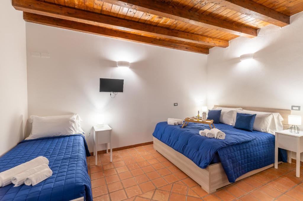 Postel nebo postele na pokoji v ubytování Elsa d'Ortigia - I TRE ARCHI