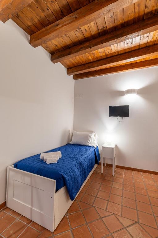 Postel nebo postele na pokoji v ubytování Elsa d'Ortigia - I TRE ARCHI