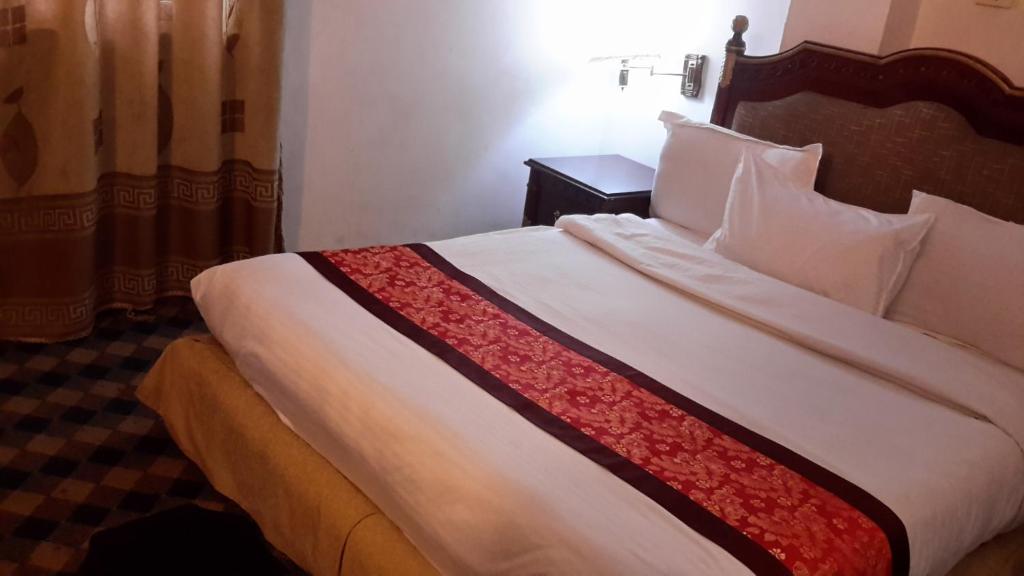 Postel nebo postele na pokoji v ubytování Kk Hotel