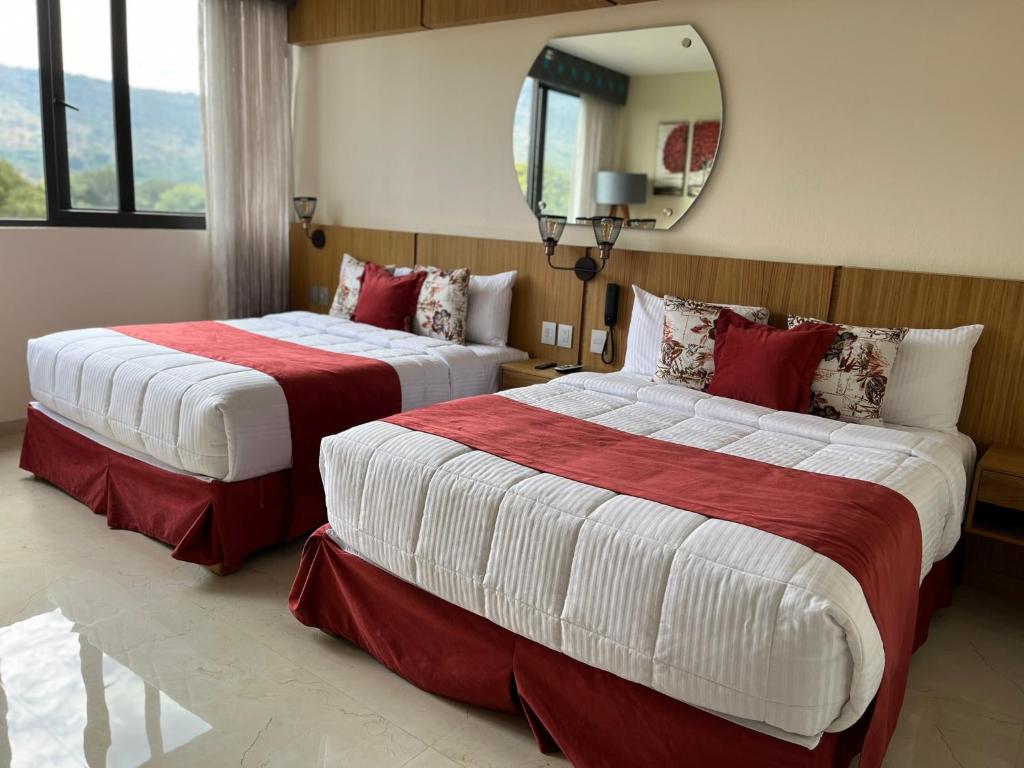 Postel nebo postele na pokoji v ubytování Hotel Cinco Diamantes
