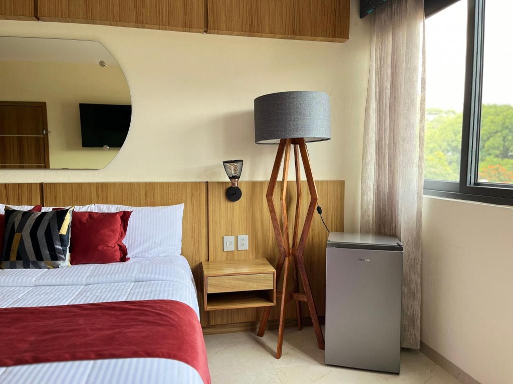 Postel nebo postele na pokoji v ubytování Hotel Cinco Diamantes
