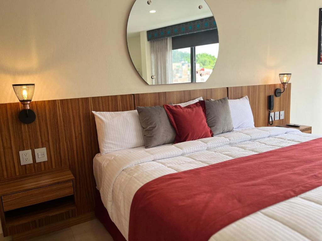 Postel nebo postele na pokoji v ubytování Hotel Cinco Diamantes