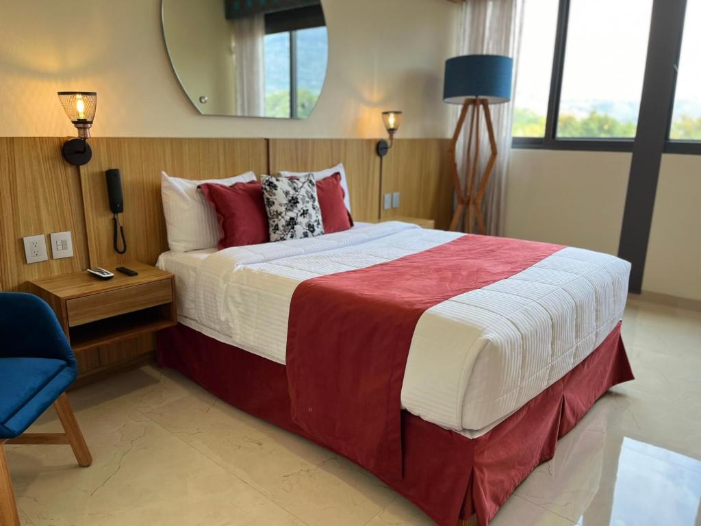 Postel nebo postele na pokoji v ubytování Hotel Cinco Diamantes