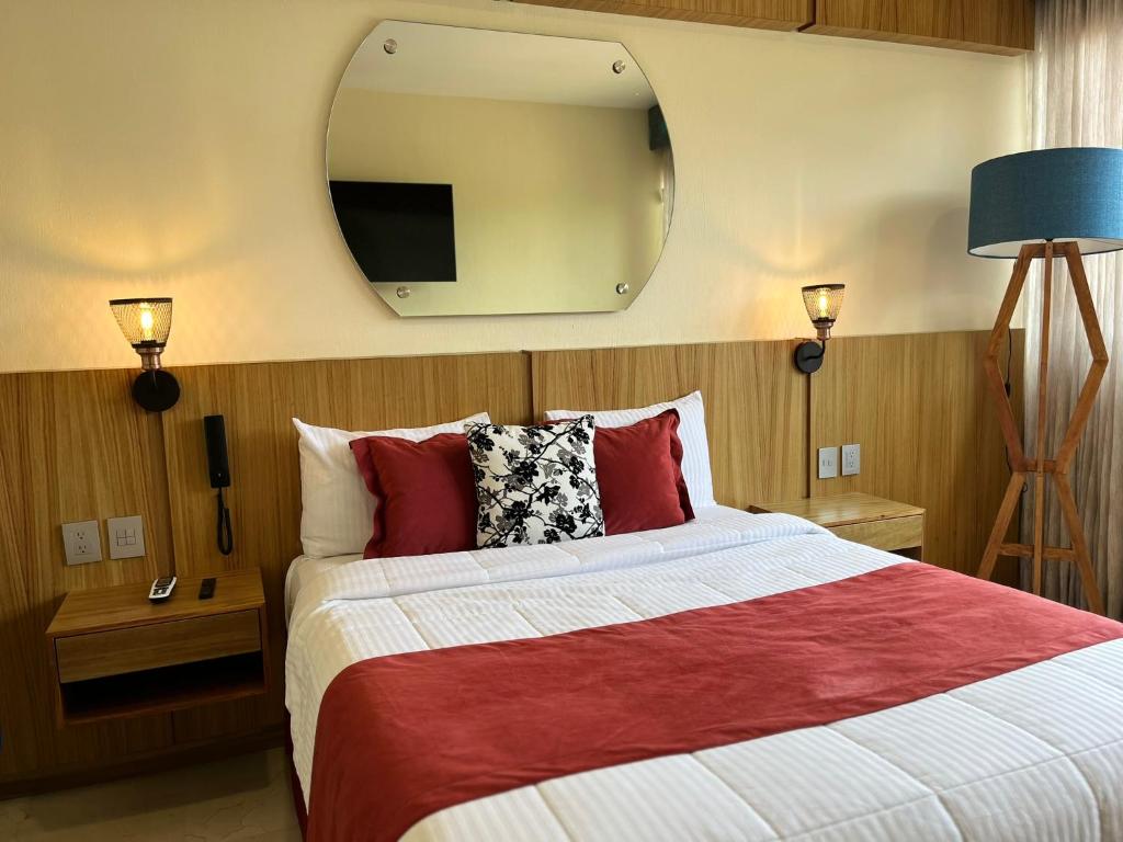 Postel nebo postele na pokoji v ubytování Hotel Cinco Diamantes