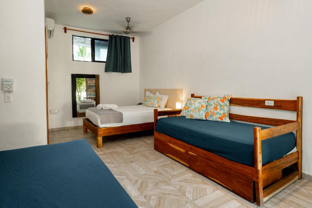 Postel nebo postele na pokoji v ubytování Casa Cuyo Hotel