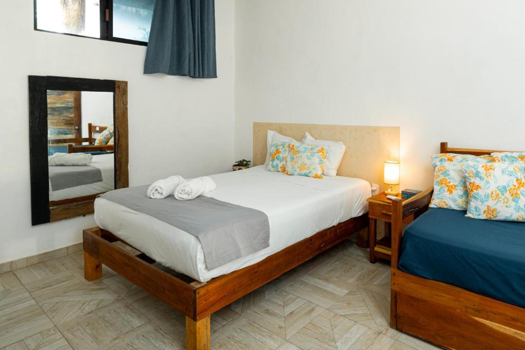 Postel nebo postele na pokoji v ubytování Casa Cuyo Hotel
