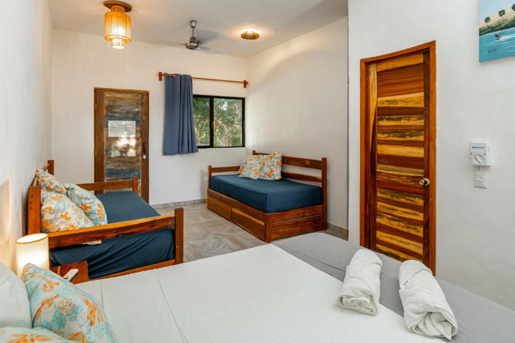 Postel nebo postele na pokoji v ubytování Casa Cuyo Hotel