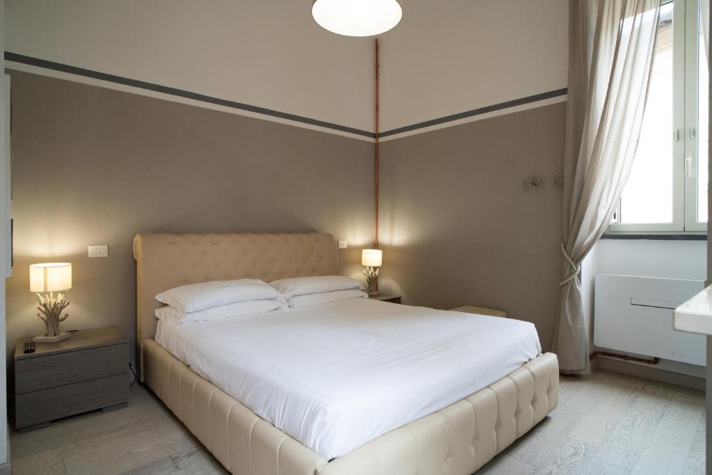 A bed or beds in a room at La Dimora alle Scalette