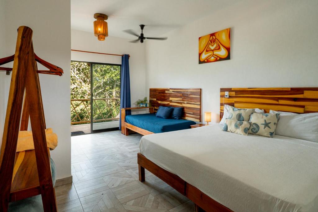 Postel nebo postele na pokoji v ubytování Casa Cuyo Hotel