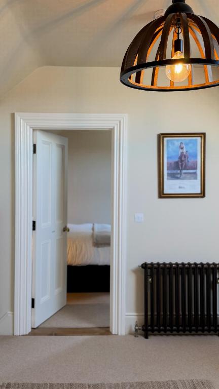 A bed or beds in a room at The Stables Kildare - adults only