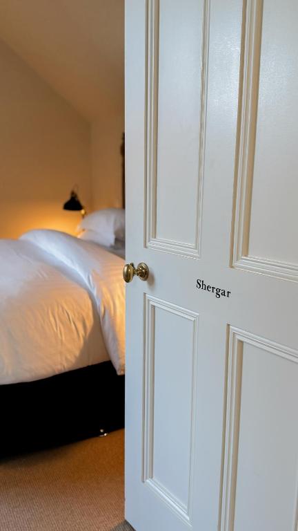 A bed or beds in a room at The Stables Kildare - adults only