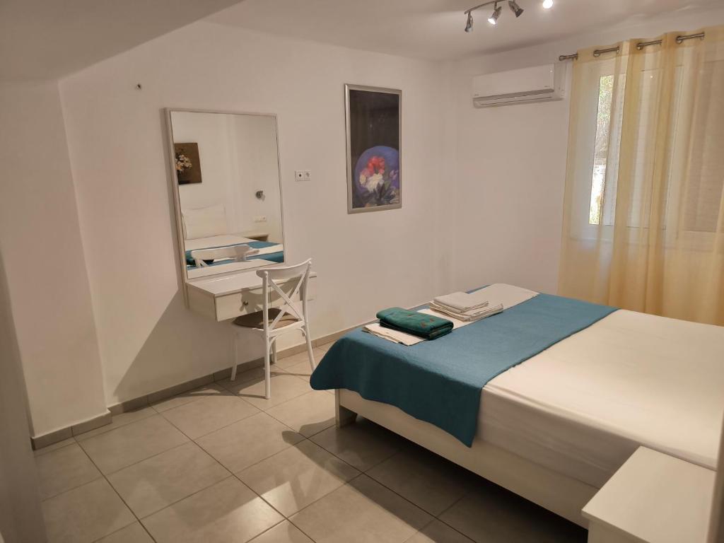 Postel nebo postele na pokoji v ubytování Alexia Rooms