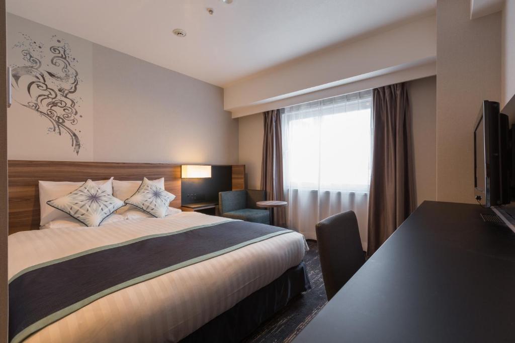 Postel nebo postele na pokoji v ubytování Matsue Excel Hotel Tokyu