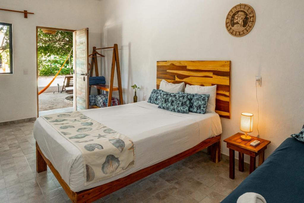 Postel nebo postele na pokoji v ubytování Casa Cuyo Hotel
