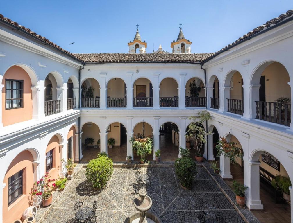 an exterior view of a building with a courtyard at Hotel La Plazuela in Popayan