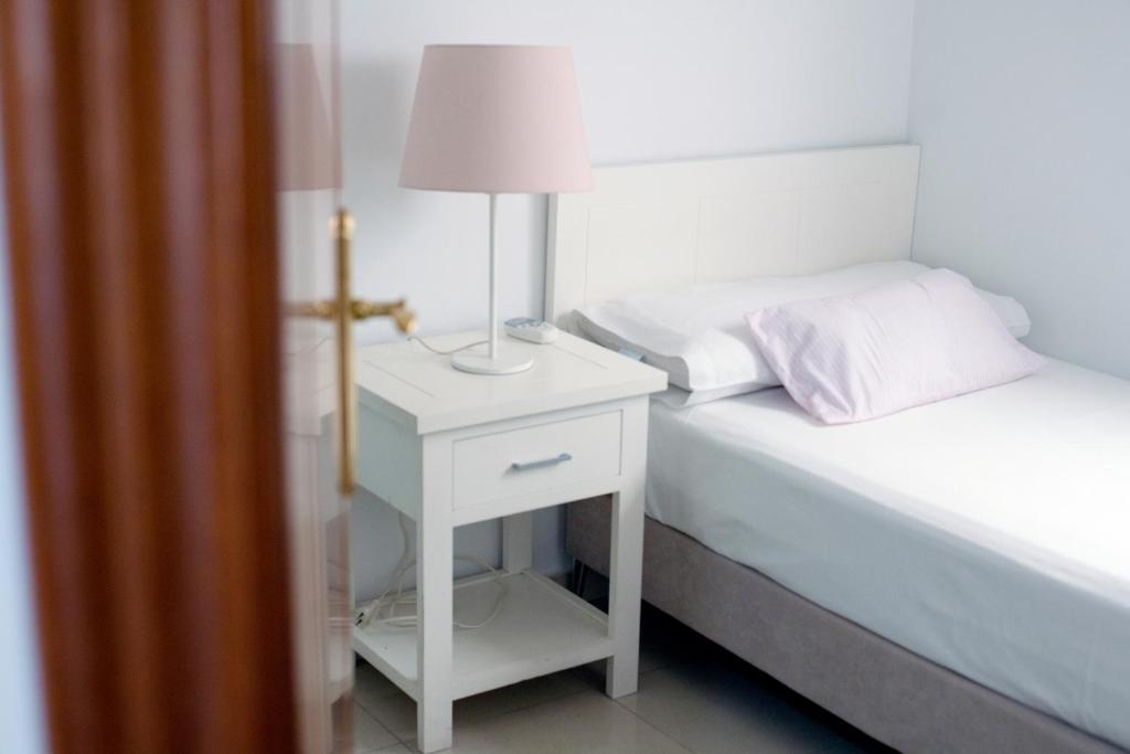 Postel nebo postele na pokoji v ubytování El Marqués San Juan