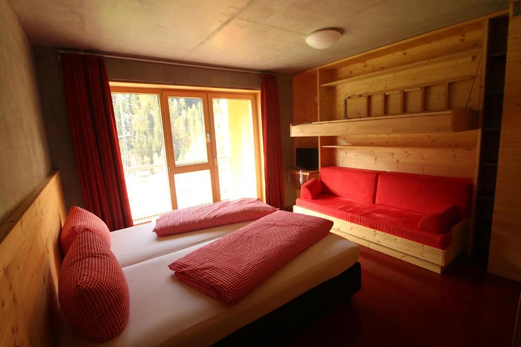 Postel nebo postele na pokoji v ubytování Base Aktivhotel Montafon
