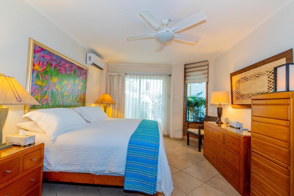 En eller flere senge i et værelse på Los Muertos Escape