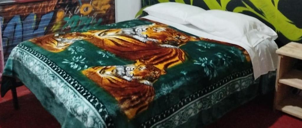 Postel nebo postele na pokoji v ubytování Hostal Mama Julia