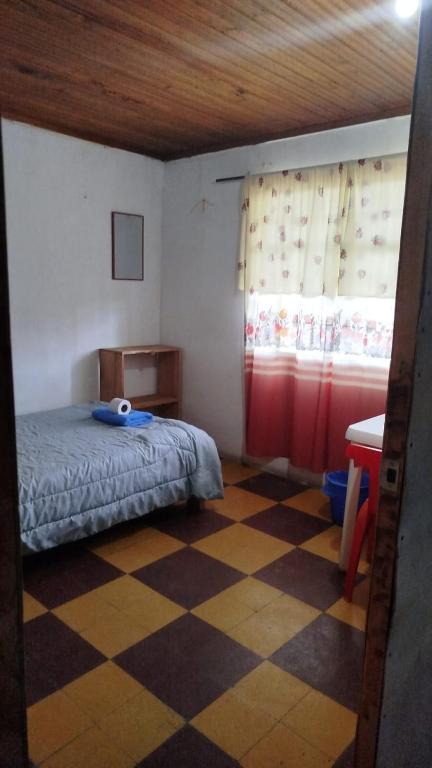 Postel nebo postele na pokoji v ubytování Hostal Mama Julia