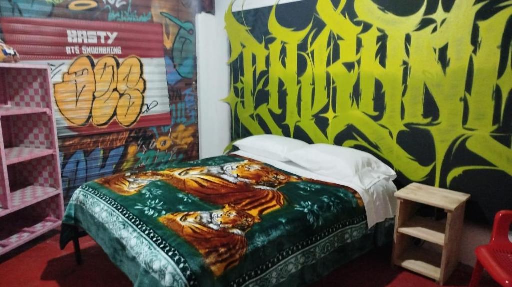 Postel nebo postele na pokoji v ubytování Hostal Mama Julia