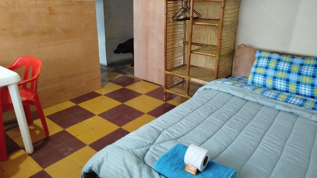 Postel nebo postele na pokoji v ubytování Hostal Mama Julia