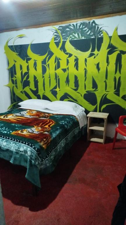 Postel nebo postele na pokoji v ubytování Hostal Mama Julia