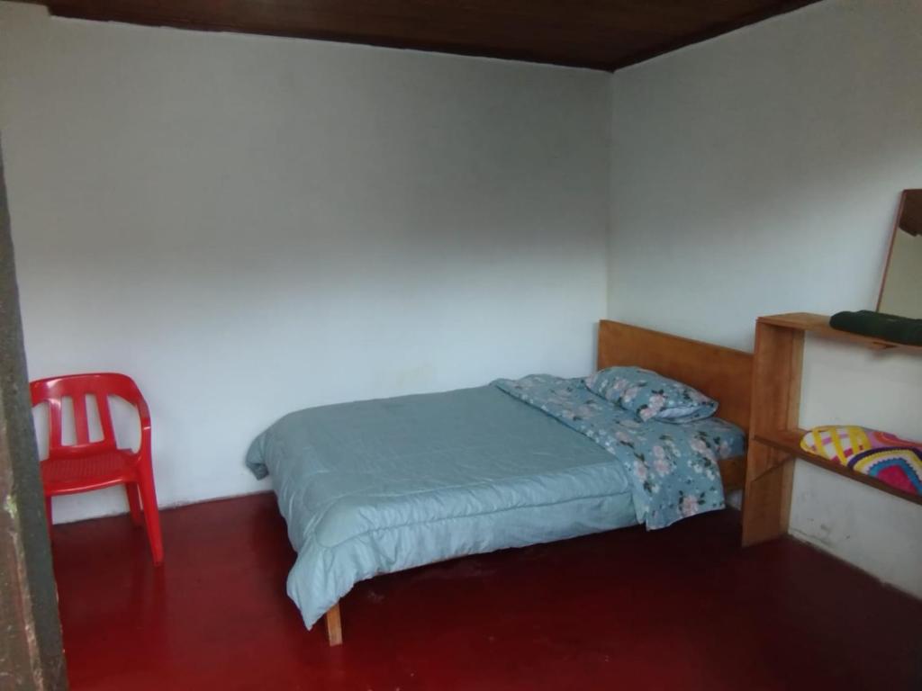 Postel nebo postele na pokoji v ubytování Hostal Mama Julia