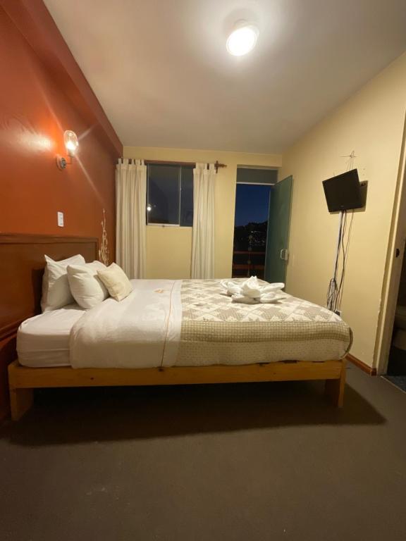 Postel nebo postele na pokoji v ubytování Hotel Andean Host Inn