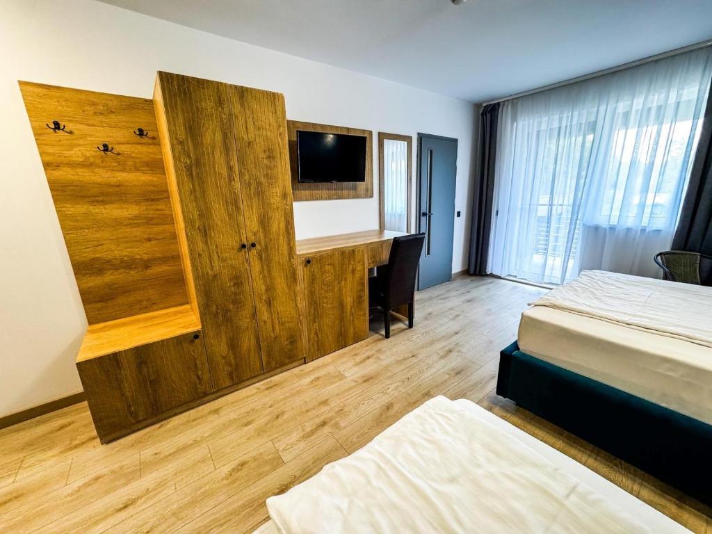 Postel nebo postele na pokoji v ubytování Hotel Dalia