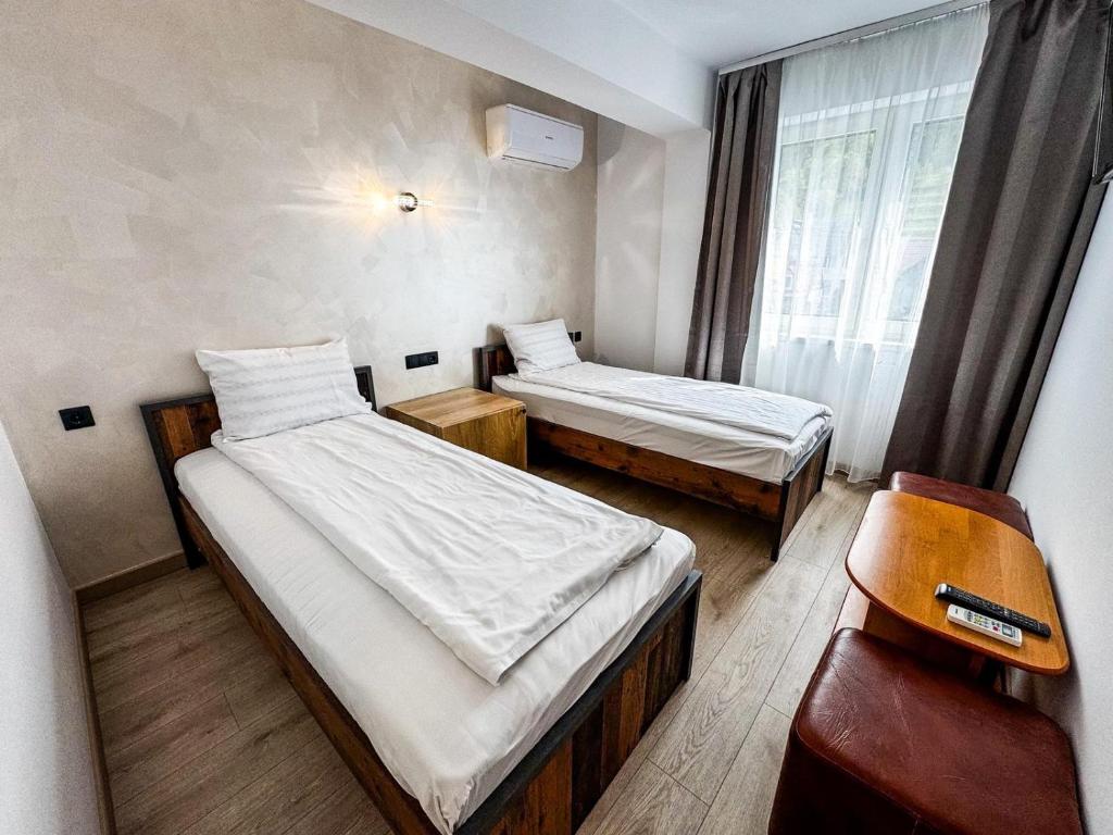 Postel nebo postele na pokoji v ubytování Hotel Dalia