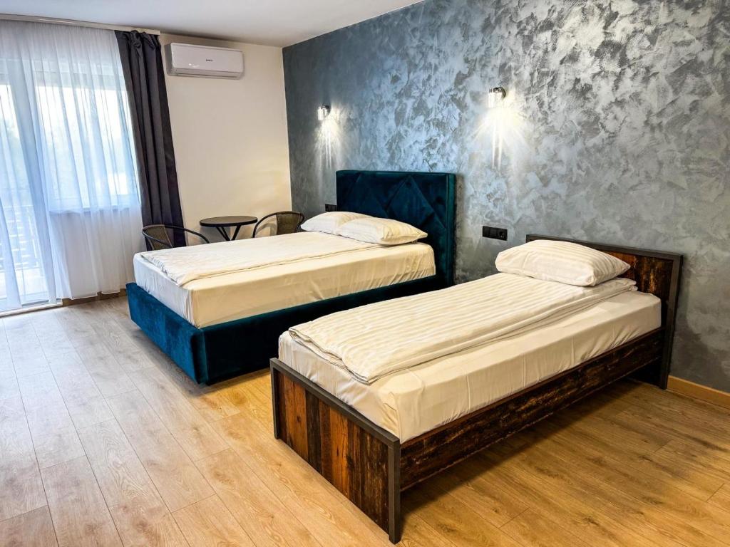 Postel nebo postele na pokoji v ubytování Hotel Dalia