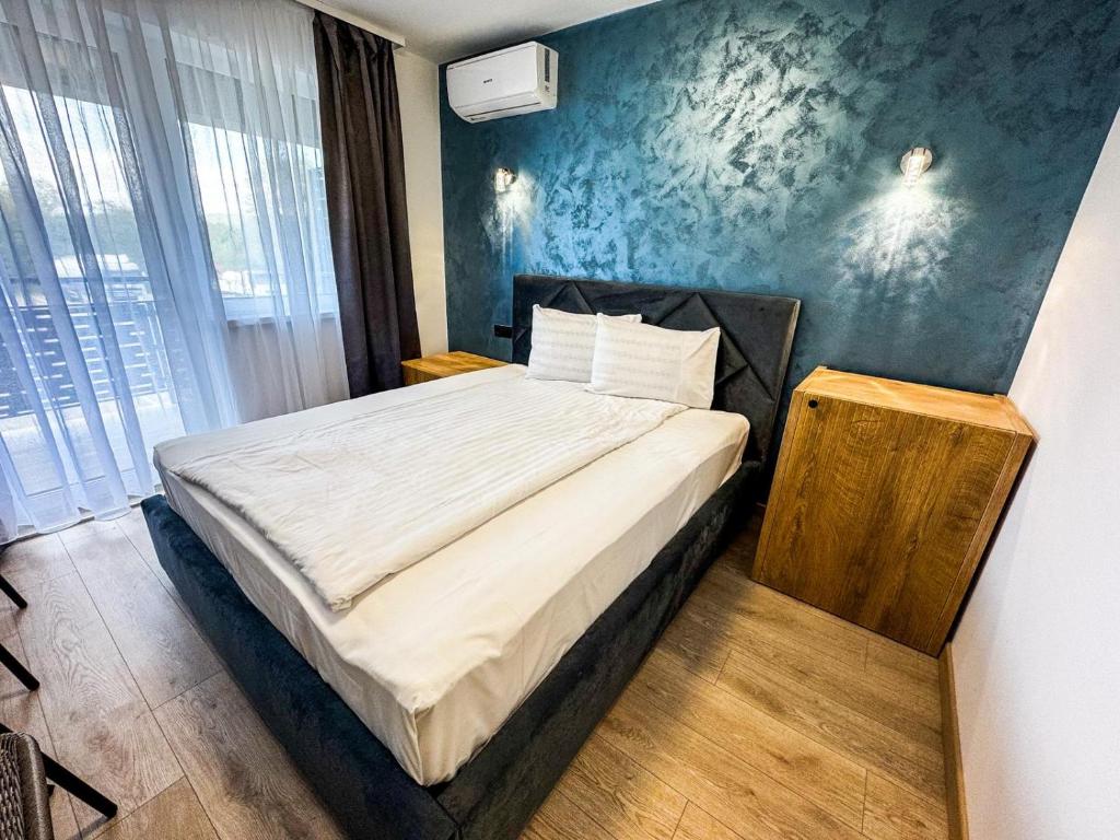 Postel nebo postele na pokoji v ubytování Hotel Dalia