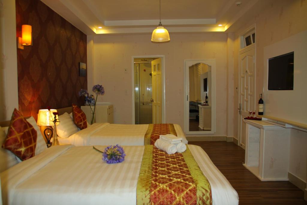 Giường trong phòng chung tại Arapang Hotel