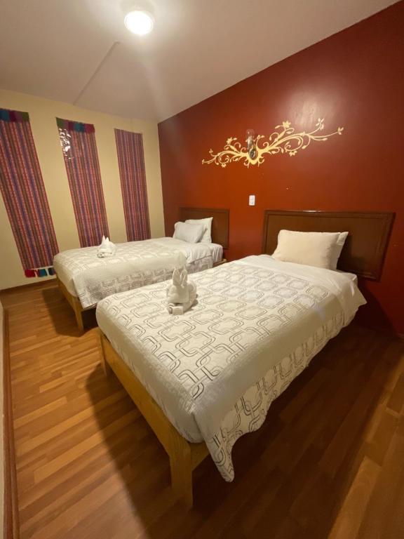 Postel nebo postele na pokoji v ubytování Hotel Andean Host Inn