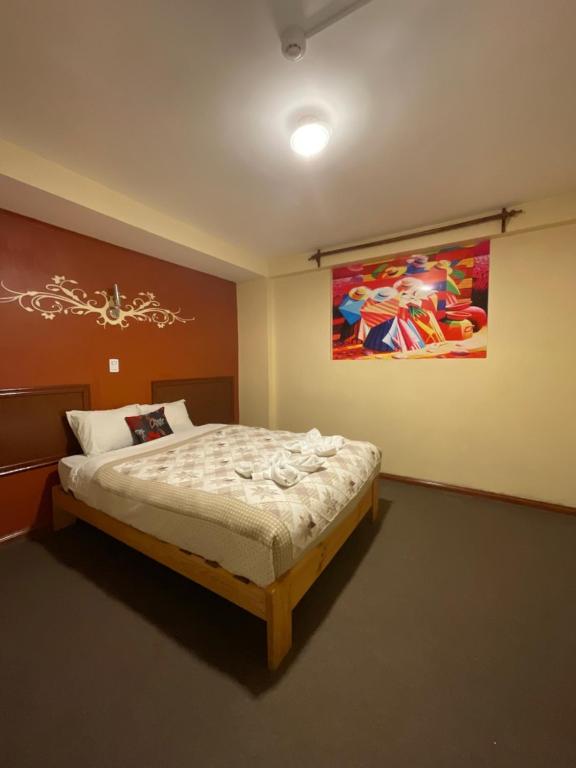 Postel nebo postele na pokoji v ubytování Hotel Andean Host Inn