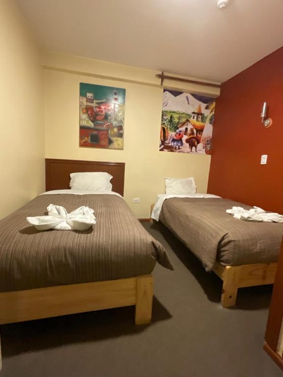 Postel nebo postele na pokoji v ubytování Hotel Andean Host Inn