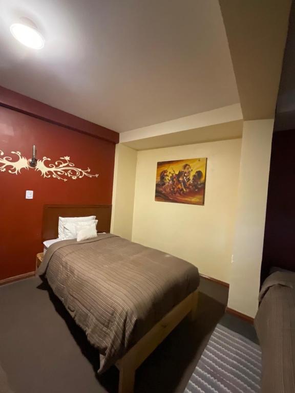 Postel nebo postele na pokoji v ubytování Hotel Andean Host Inn