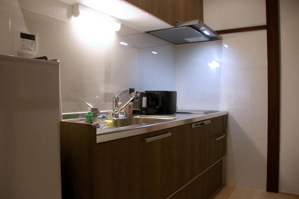 Kuchyň nebo kuchyňský kout v ubytování 龍助25ANNEX Ryusuke25ANNEX