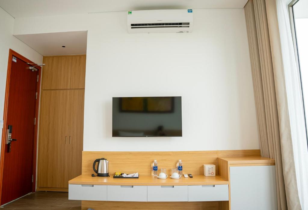 TV a/nebo společenská místnost v ubytování Min Min Hotel