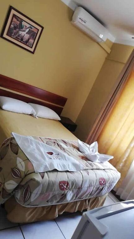Postel nebo postele na pokoji v ubytování Hostal Saloah