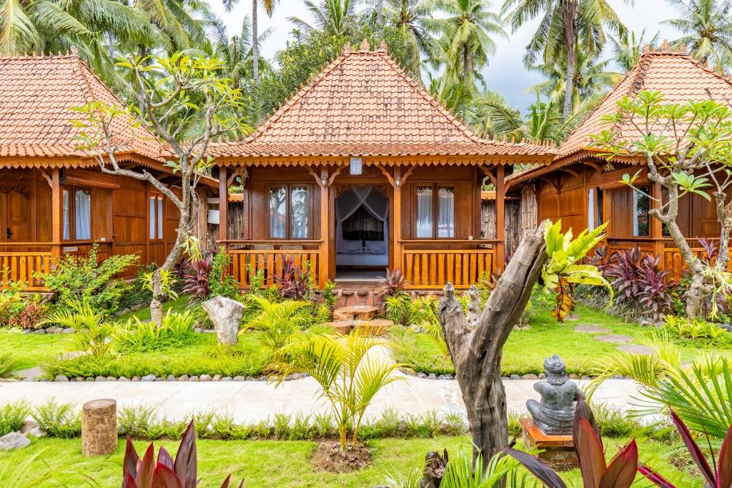 Zahrada ubytování Dani Beach Villa - Beachfront Villas in Penuktukan