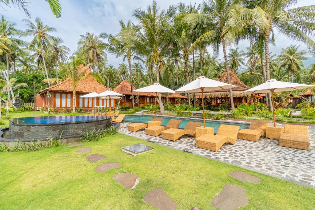Zahrada ubytování Dani Beach Villa - Beachfront Villas in Penuktukan