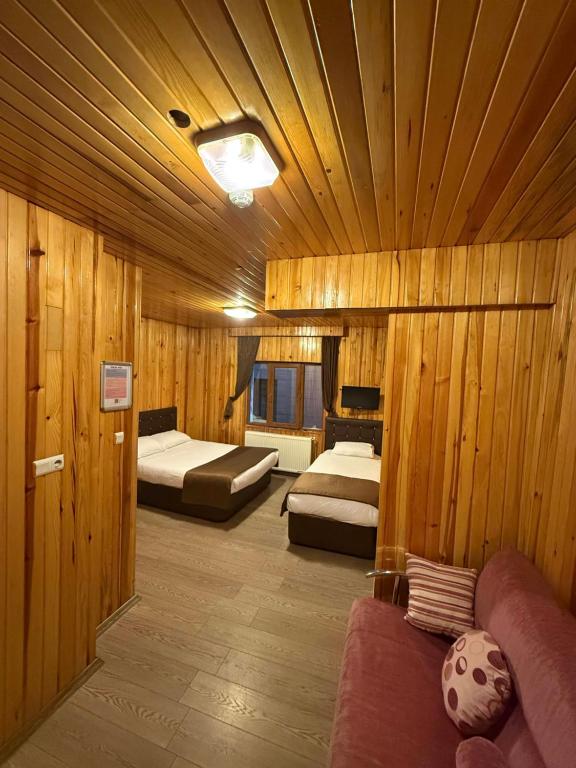 A bed or beds in a room at Ozkan Otel