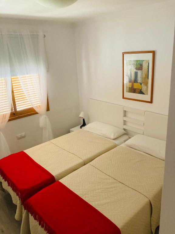 A bed or beds in a room at Sunny MASPALOMAS