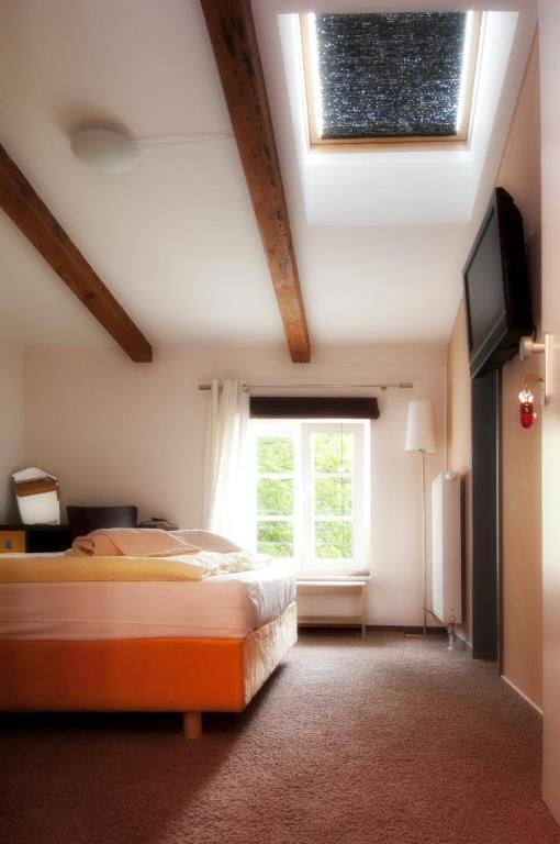 Postel nebo postele na pokoji v ubytování Perle Hotel